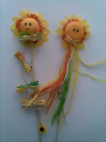Bild von Sonnenblumengesichter auf Stab
